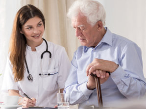 caregiver listing the medications of senior man