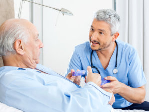 caregiver giving senior man his medications